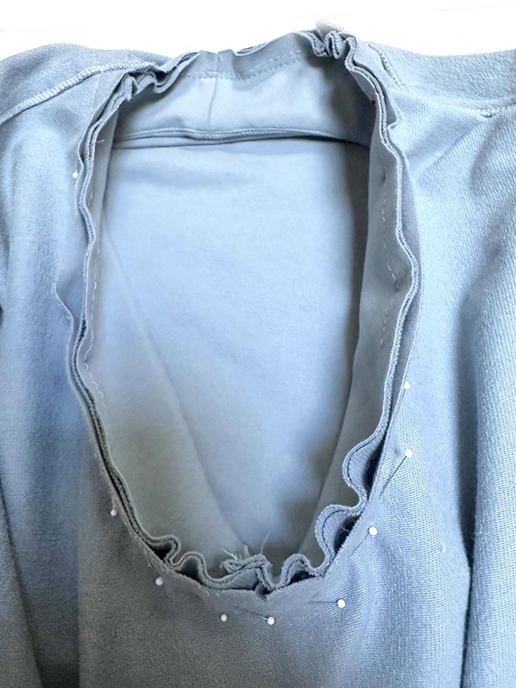 Pin band to neck.