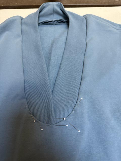 Attach band to neck.